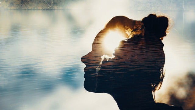 A woman head with a bright sun