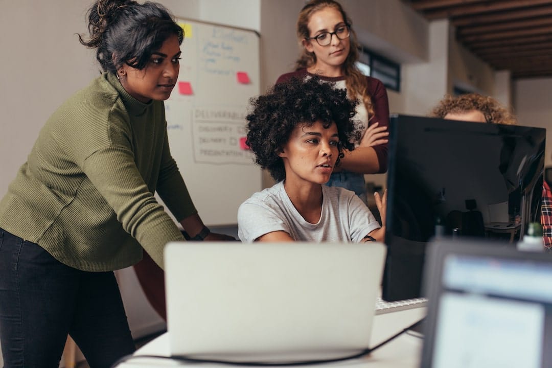 Women working on a computer screen