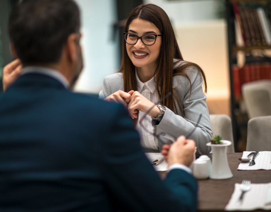 Woman talking to a person in an office